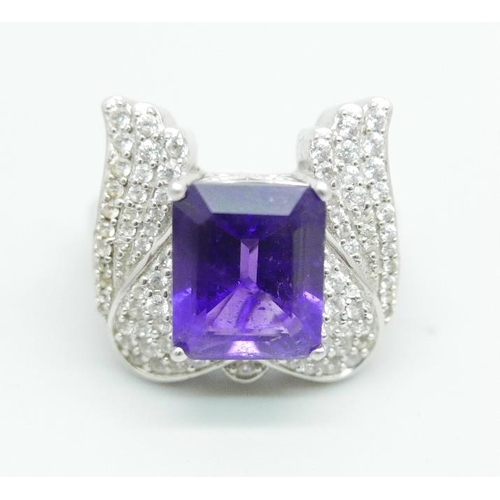 1094 - A silver ring with an amethyst and cubic zirconia set wing detail, size Q, by TJC