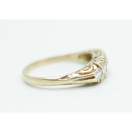 1096 - A 9ct gold ring set with white stones, 2.6g, P