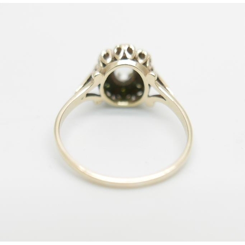 1099 - A 9ct gold ring set with a clear central stone and diamond chip halo, 2.2g, O