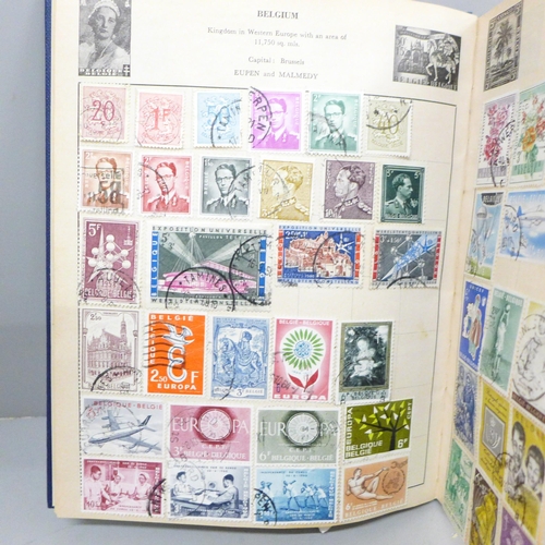 650 - A stamp album and a collection of postcards