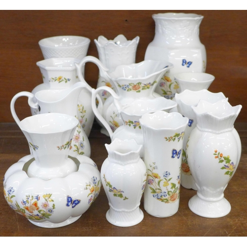 681 - A collection of fourteen Aynsley Cottage Garden vases and jugs