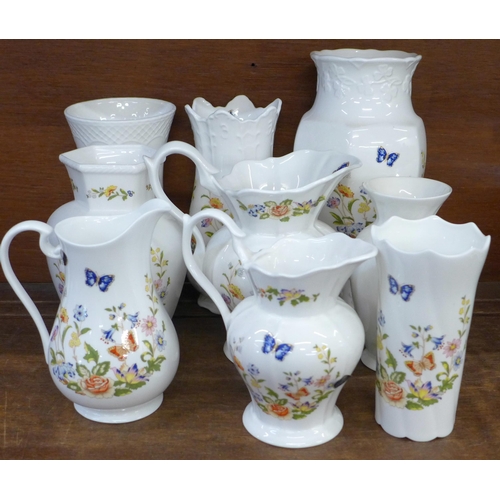 681 - A collection of fourteen Aynsley Cottage Garden vases and jugs