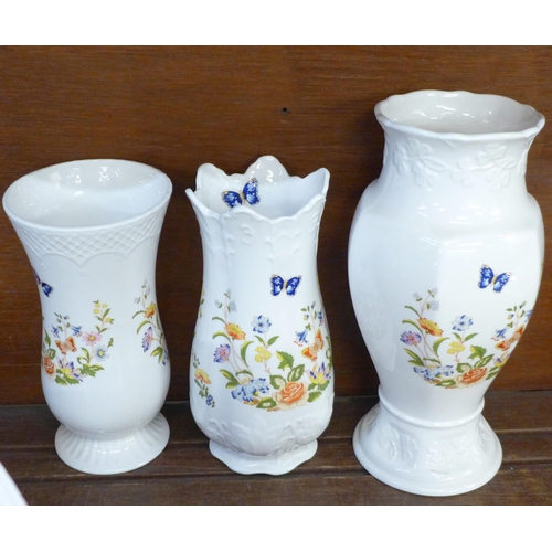 681 - A collection of fourteen Aynsley Cottage Garden vases and jugs