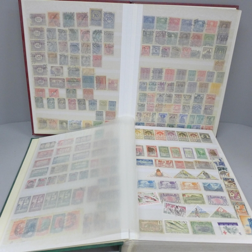 686 - A box file of World stamps in two albums