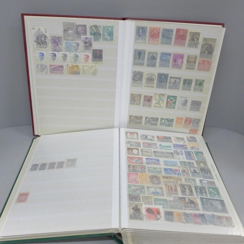 686 - A box file of World stamps in two albums