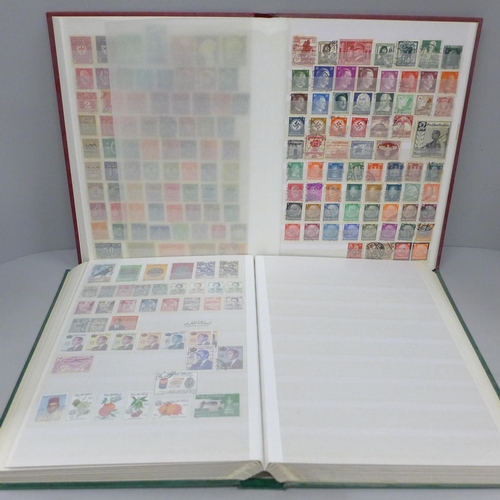 686 - A box file of World stamps in two albums