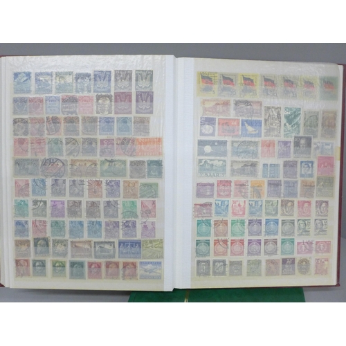 686 - A box file of World stamps in two albums