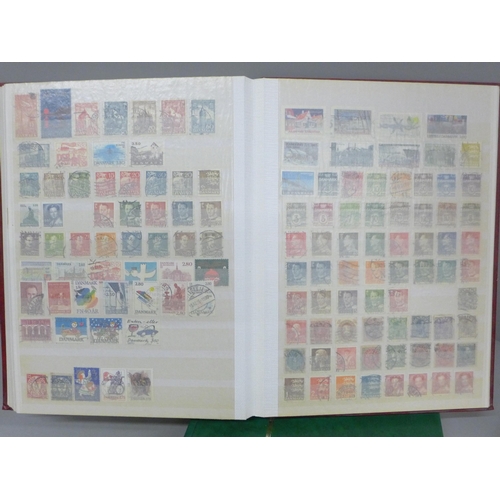 686 - A box file of World stamps in two albums