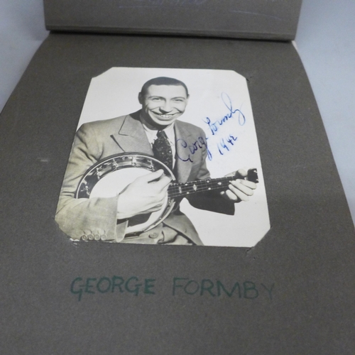 688 - An album of signed celebrity publicity photographs, over 20 signed and facsimile autographs includin... 