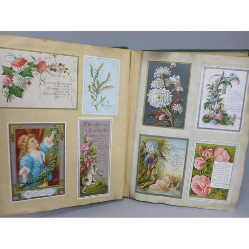 689 - An album of Victorian greeting cards, 240 in total, Christmas, New Year and Birthday, interspersed w... 