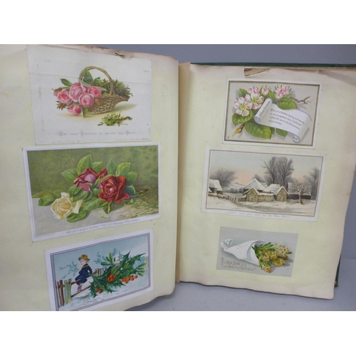 689 - An album of Victorian greeting cards, 240 in total, Christmas, New Year and Birthday, interspersed w... 