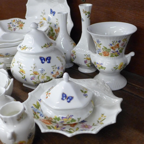 691 - A collection of early Aynsley Cottage Garden china, includes shell shaped dish, three lidded pots, t... 