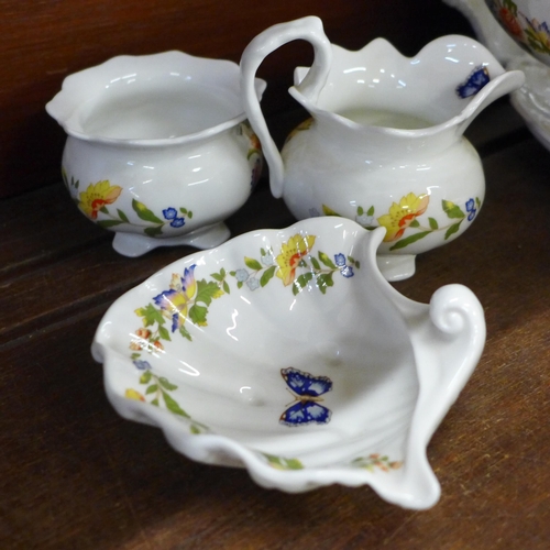 691 - A collection of early Aynsley Cottage Garden china, includes shell shaped dish, three lidded pots, t... 