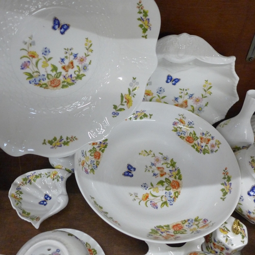 691 - A collection of early Aynsley Cottage Garden china, includes shell shaped dish, three lidded pots, t... 