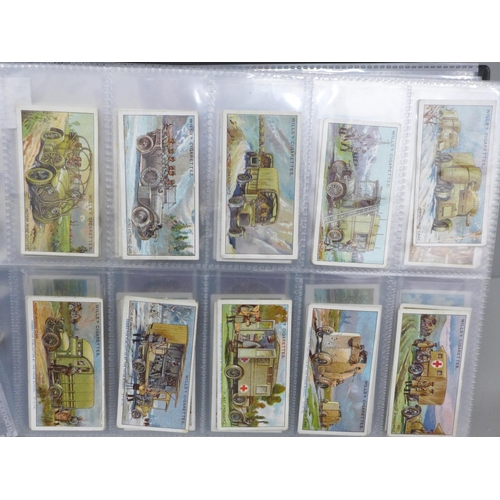 693 - An album of cigarette cards with 10 complete sets including Wills 'Military Motors', Players 'Shakes... 