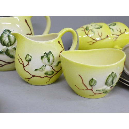 700 - A Carlton Ware Magnolia pattern six setting tea set