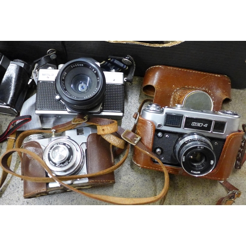 708 - Vintage cameras including Praktica, Zenit, etc.