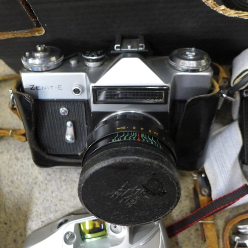 708 - Vintage cameras including Praktica, Zenit, etc.