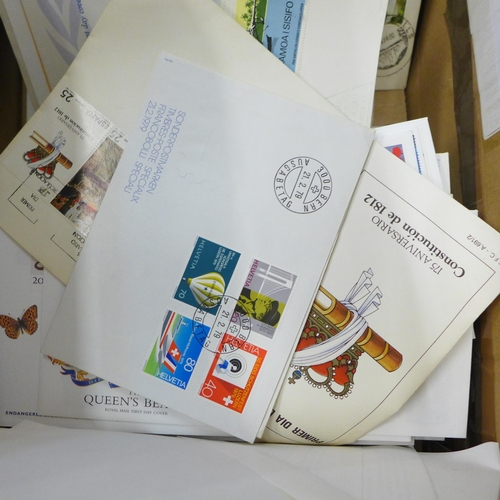 713 - Stamps; a box of stamps, worldwide first day covers in albums and loose