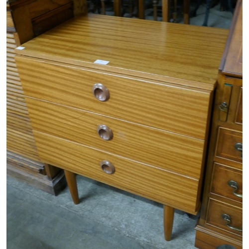 61 - A small teak chest of drawers