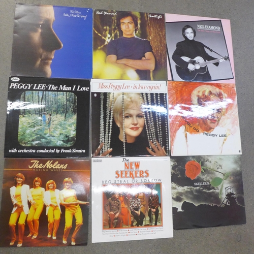 720 - A collection of LP records including Phil Collins, Moody Blues, Robert Palmer, Steve Miller, etc.