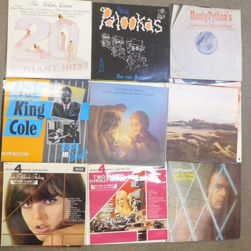 720 - A collection of LP records including Phil Collins, Moody Blues, Robert Palmer, Steve Miller, etc.