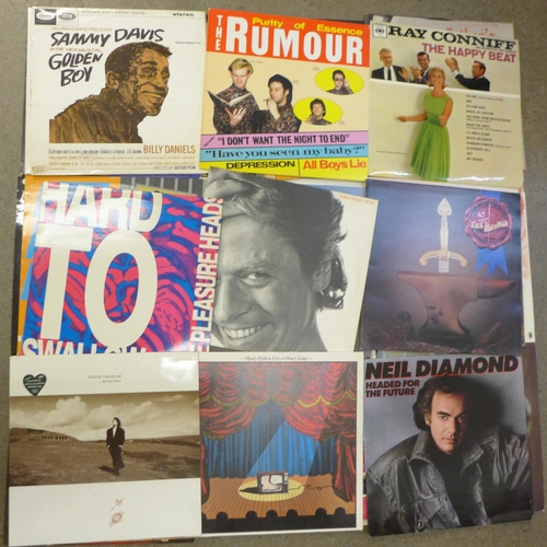 720 - A collection of LP records including Phil Collins, Moody Blues, Robert Palmer, Steve Miller, etc.