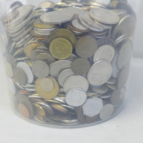 742 - A container of mixed foreign coins