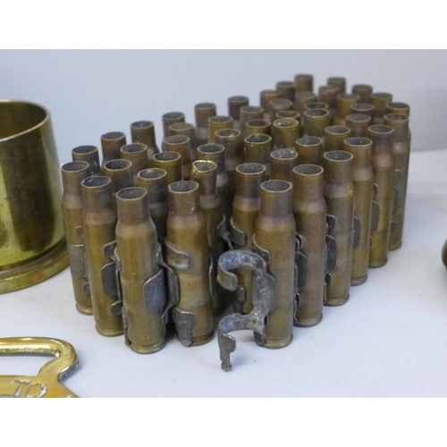 745 - Military related items including a brass matchbox holder/ash tray with insignia, spike bayonet, ammu... 