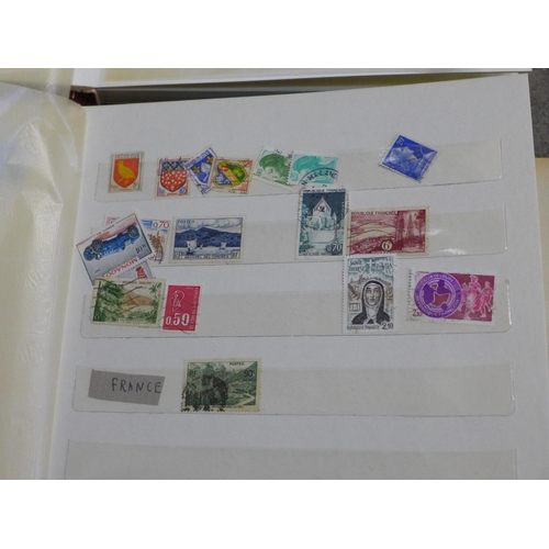 748 - A collection of stamp albums and first day covers including 'Birds & Flowers of the 50 States', and ... 