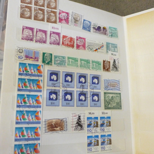 748 - A collection of stamp albums and first day covers including 'Birds & Flowers of the 50 States', and ... 