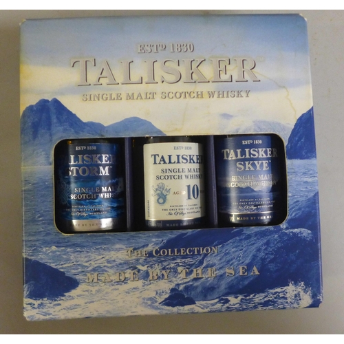 786 - Talister: The Collection by the Sea set of three, one bottle of Bell's and two bottles of dessert wi... 