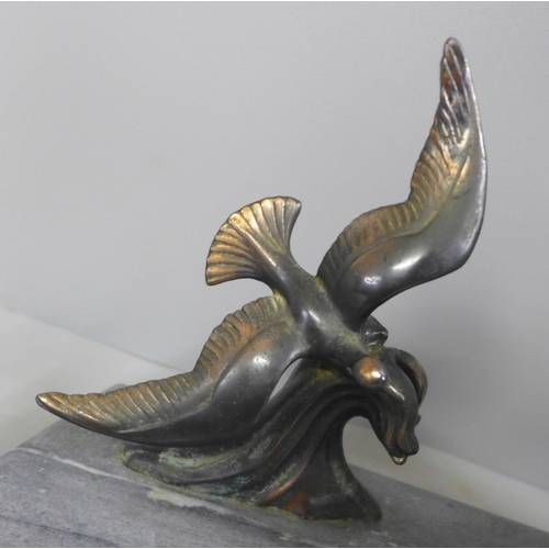 788 - An Art Deco lamp with bird decoration on a marble plinth