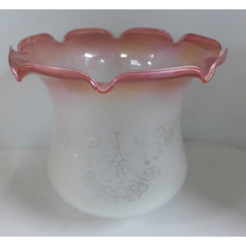 795 - A cranberry glass oil lampshade, one other etched glass shade and an etched pink glass shade