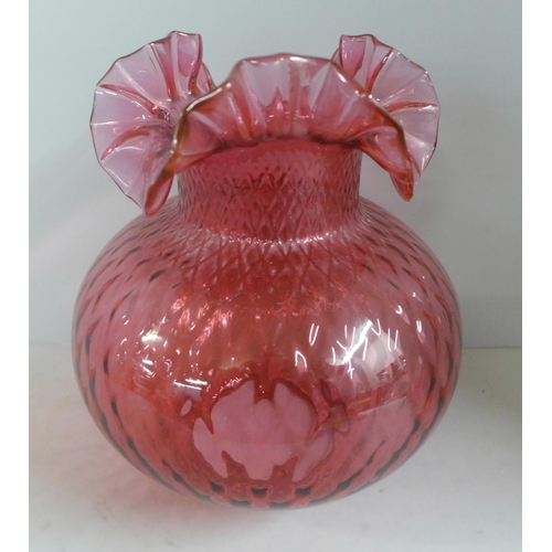 795 - A cranberry glass oil lampshade, one other etched glass shade and an etched pink glass shade