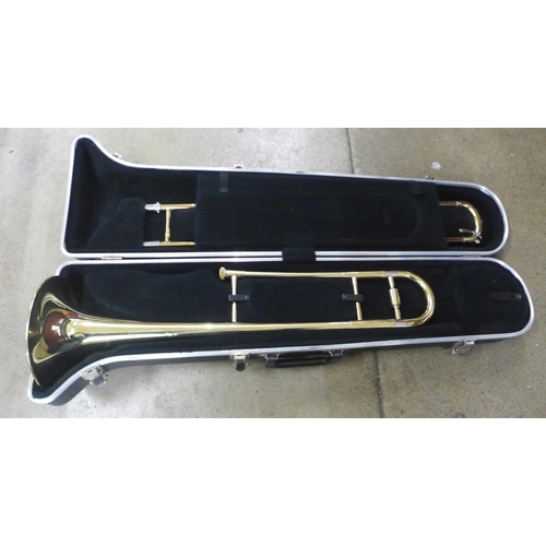 797 - A Blessing USA trombone, cased, dented in some parts