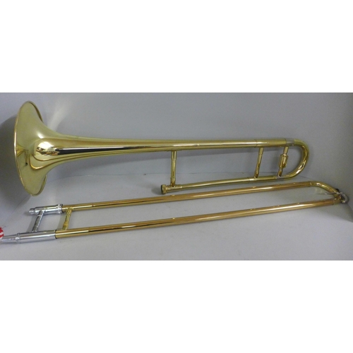 797 - A Blessing USA trombone, cased, dented in some parts