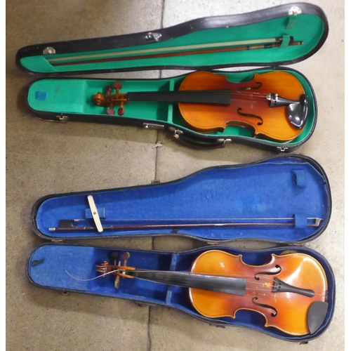 805 - Two cased violins and bows, both backs 33.5cm approximately excluding button