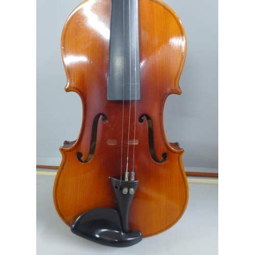 805 - Two cased violins and bows, both backs 33.5cm approximately excluding button