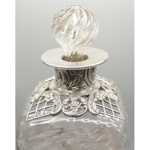 819A - A Victorian silver topped twisted glass decanter, London 1892