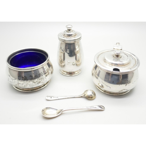 825 - A silver condiment set, London 1940, and two silver spoons, 121g