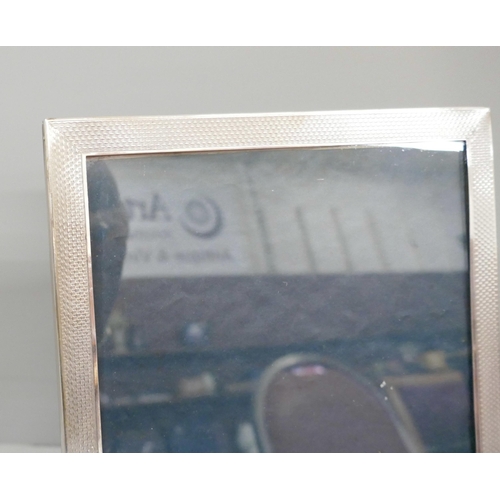 829 - A silver photograph frame, 17cm wide