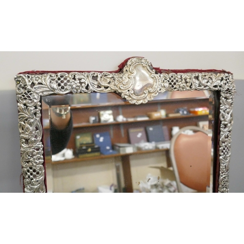 832 - A large Victorian silver framed mirror, 33cm wide