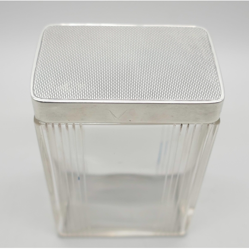 832A - An Art Deco silver topped cut glass jar. Birmingham 1939, height 88mm