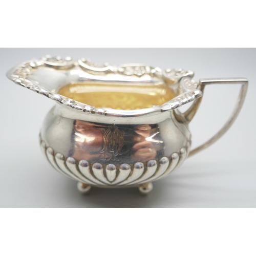 834 - A small Victorian silver jug, scroll mount and half fluted decoration, London 1894, 76g