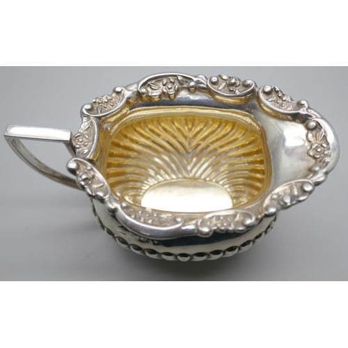 834 - A small Victorian silver jug, scroll mount and half fluted decoration, London 1894, 76g