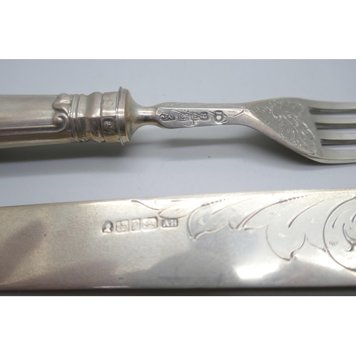 838 - A 19th Century silver knife and fork in a fitted case, Sheffield 1835