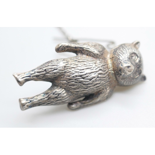 853 - A collection of silver, etc.; including silver pig pin cushion, Birmingham 1905, silver cigar rest, ... 