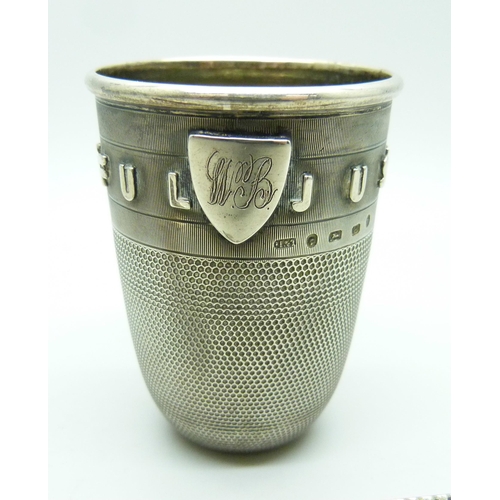 857 - A novelty Victorian silver 'Just a Thimble Full' shot cup with applied shield with initials, Birming... 