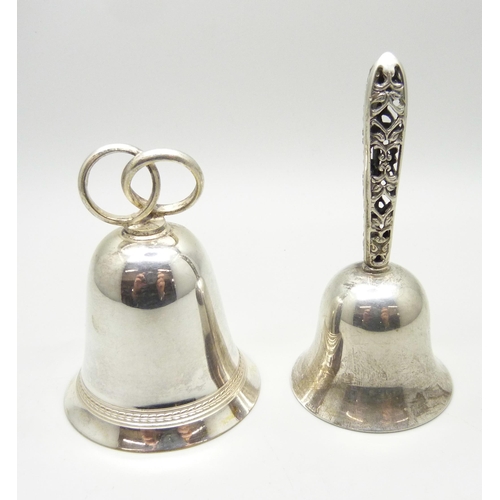 858 - A silver bell with pierced handle and one other bell